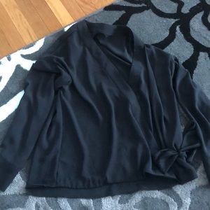 Black, v-neck, translucent blouse with tie.